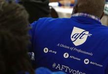 Photo of back of man wearing AFT shirt. Shirt reads "AFT - A Union of Professionals #AFTvotes"