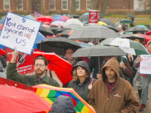 Rutgers University AAUP-AFT faculty demonstrating. Signs read "You can't ignore all of us" and "Camden deserves better"